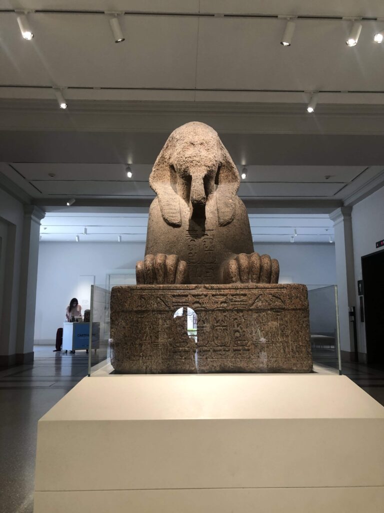 A huge sphinx statue on a platform