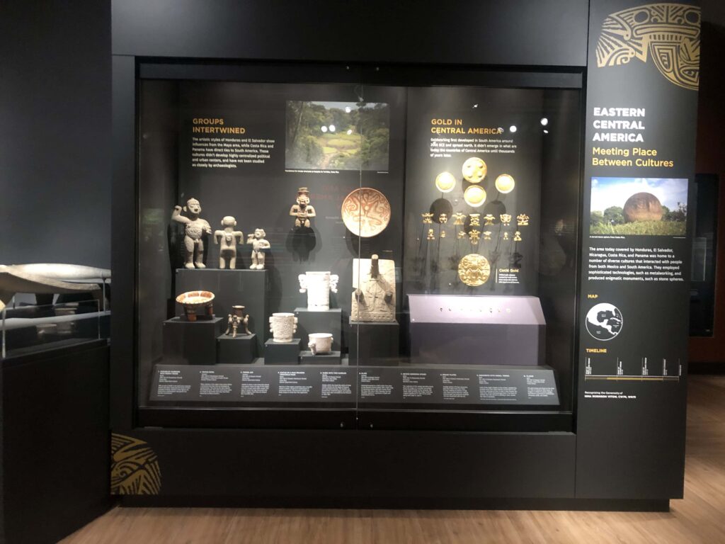 A museum display case with Mesoamerican objects