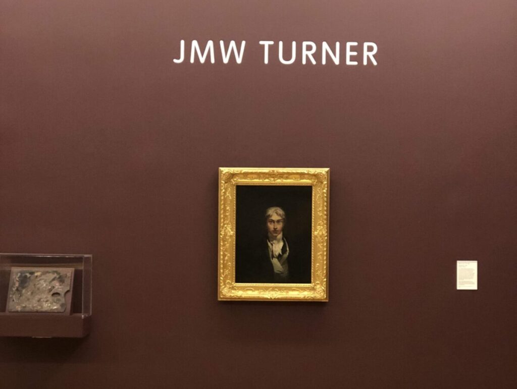 A portrait of JMW Turner on a museum wall