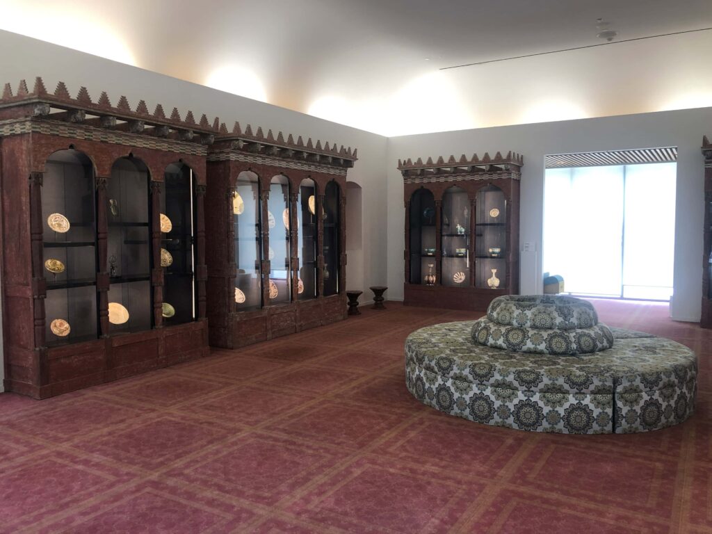 Fancy wooden cabinets displaying porcelain