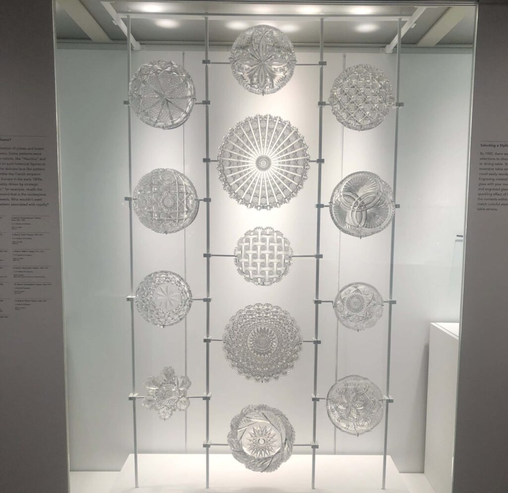 A display of cut crystal bowls and plates