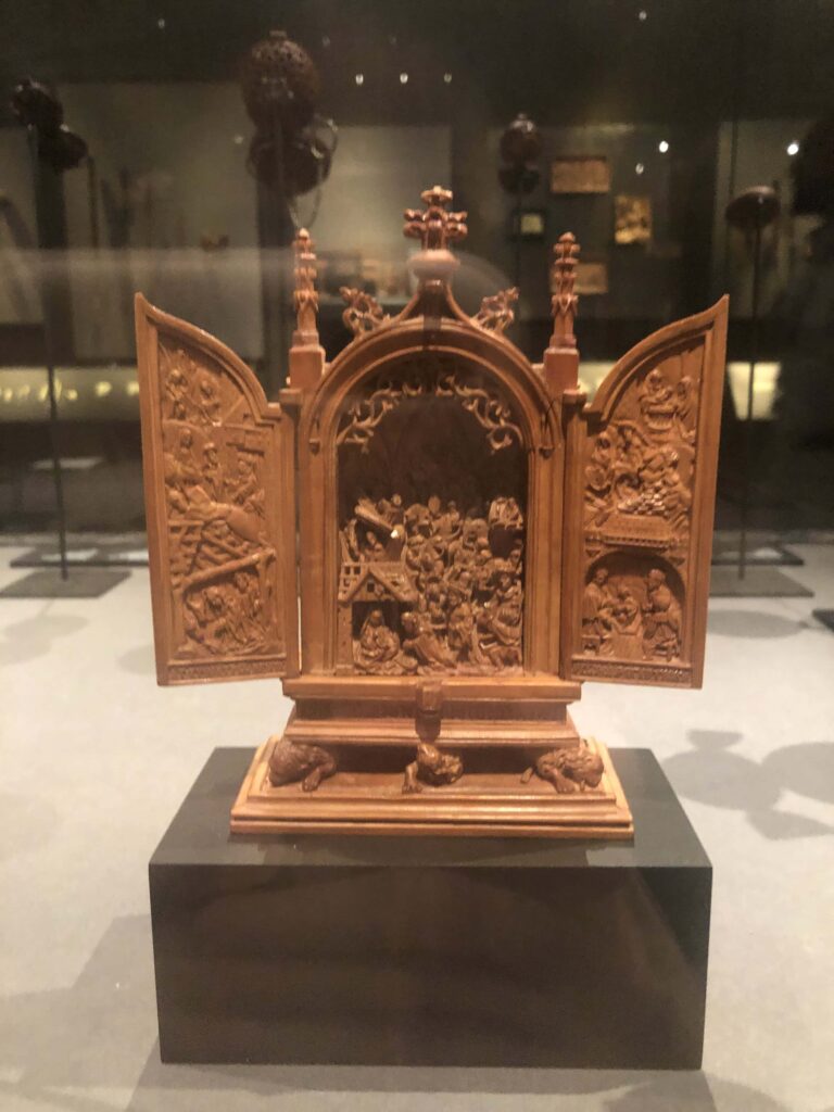 Small boxwood altarpiece with tiny religious carvings