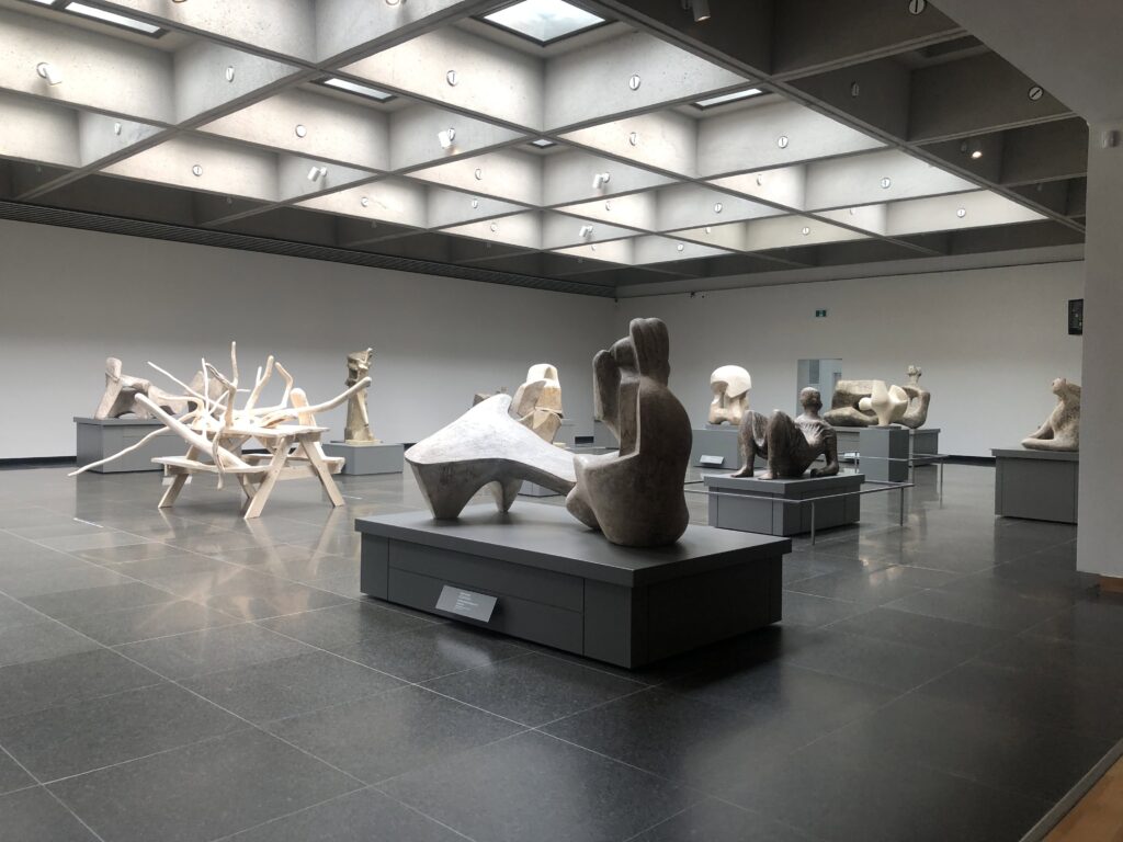 Large-scale sculptures inside a modernist gallery room